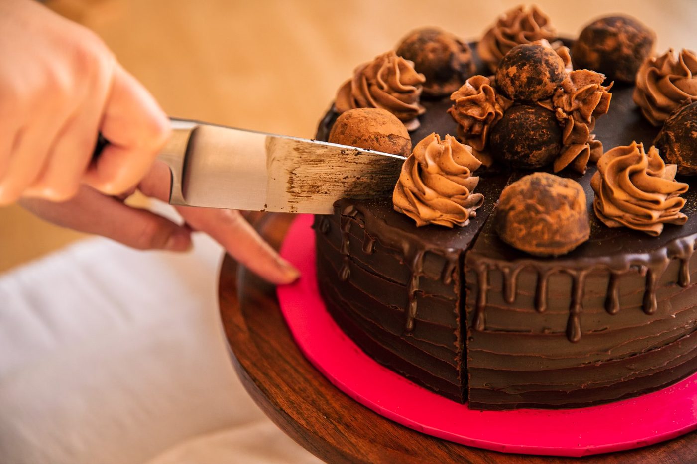 Chocolate truffle cake being sliced